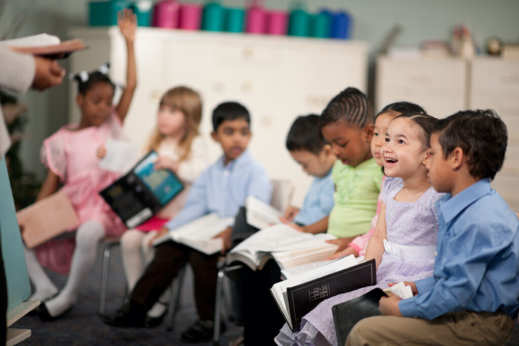 a teacher reading to young children